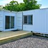Luxury two bedroom shipping container home built from one 40ft and one 20ft high cube shipping container featuring modern kitchen
