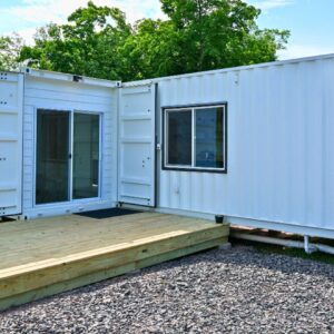 Luxury two bedroom shipping container home built from one 40ft and one 20ft high cube shipping container featuring modern kitchen
