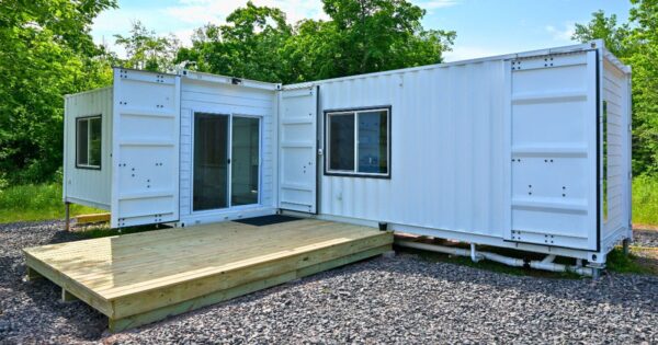Luxury two bedroom shipping container home built from one 40ft and one 20ft high cube shipping container featuring modern kitchen